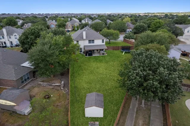 an aerial view of a house with a garden