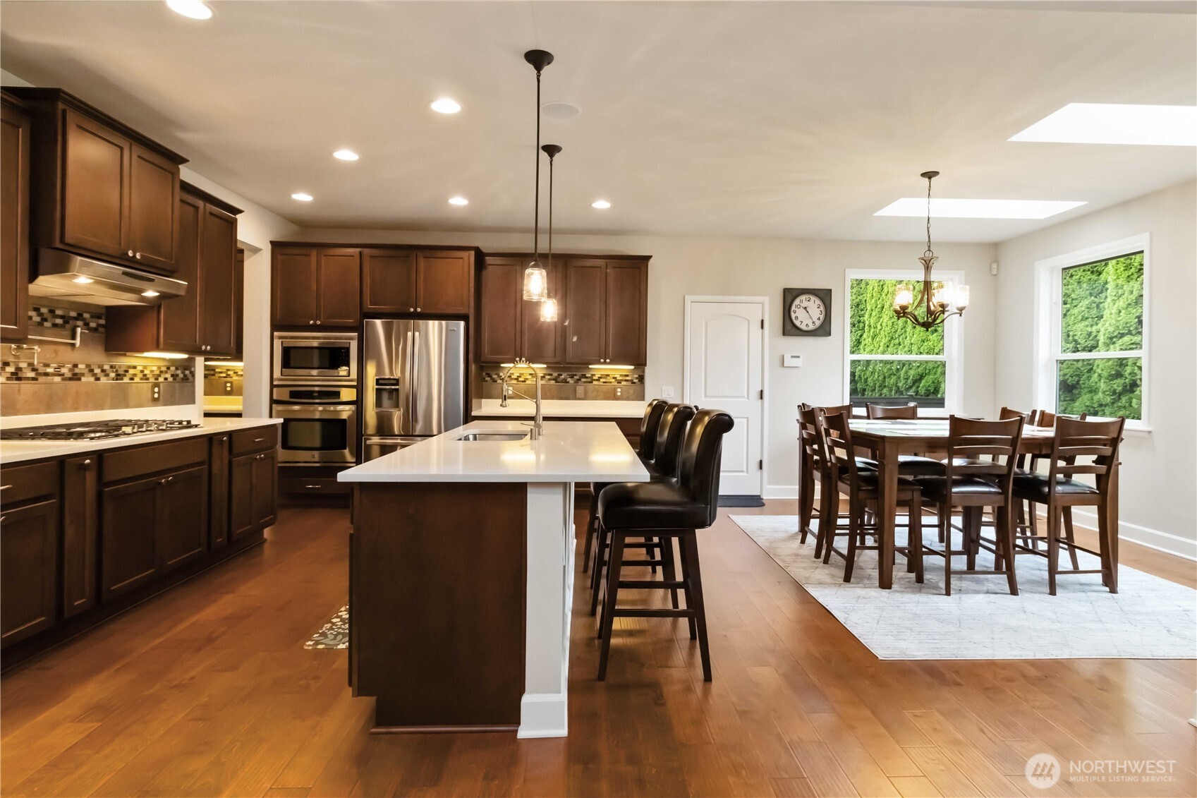 6721 Southeast 2nd Street Renton, WA 98059 - Photo 11 of 32 a large kitchen with a table and chairs