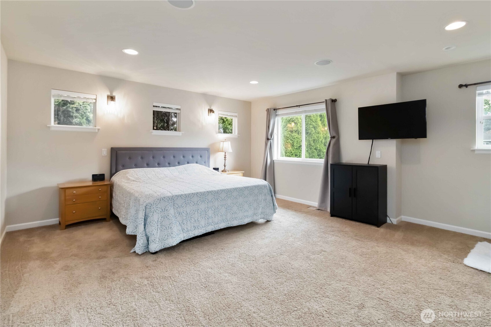 6721 Southeast 2nd Street Renton, WA 98059 - Photo 15 of 32 a bedroom with a bed a television and a window