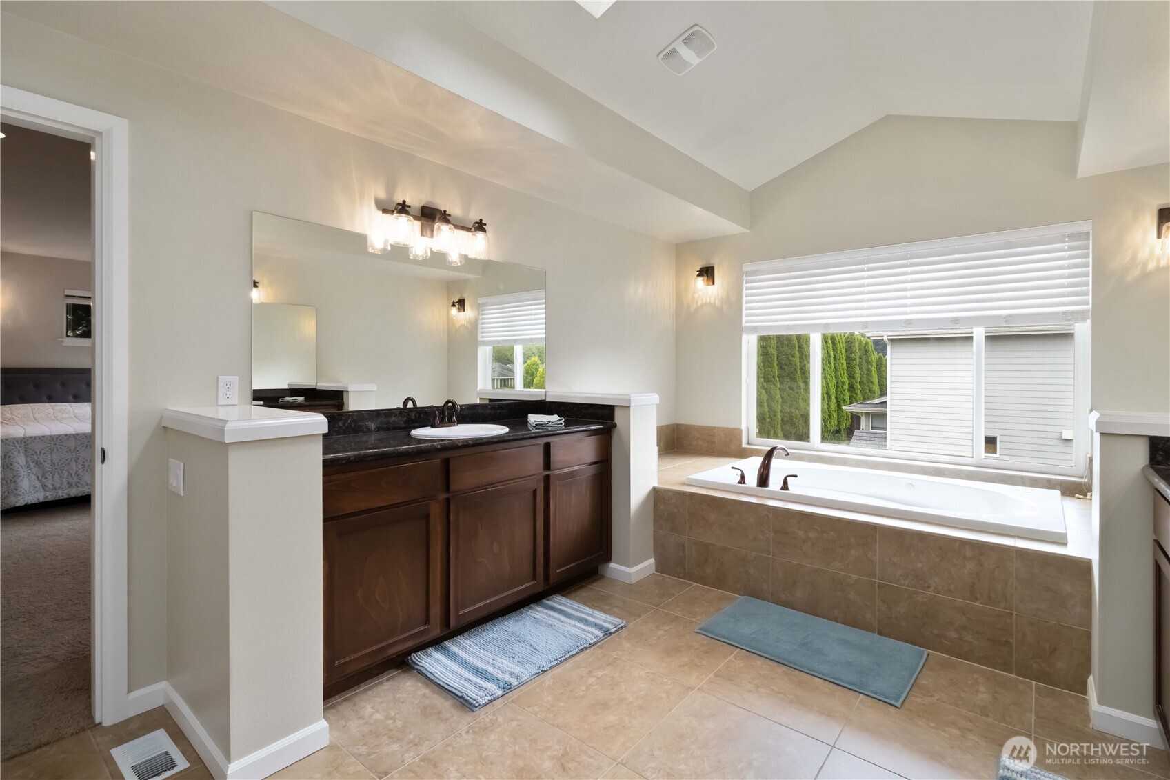 6721 Southeast 2nd Street Renton, WA 98059 - Photo 17 of 32 a large bathroom with a large tub and sink