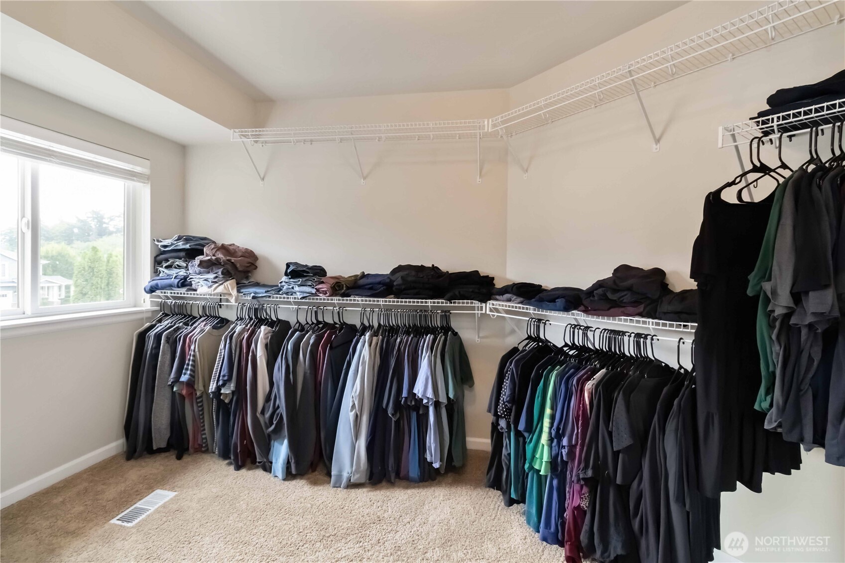 6721 Southeast 2nd Street Renton, WA 98059 - Photo 19 of 32 a view of walk in closet with clothes and shoes