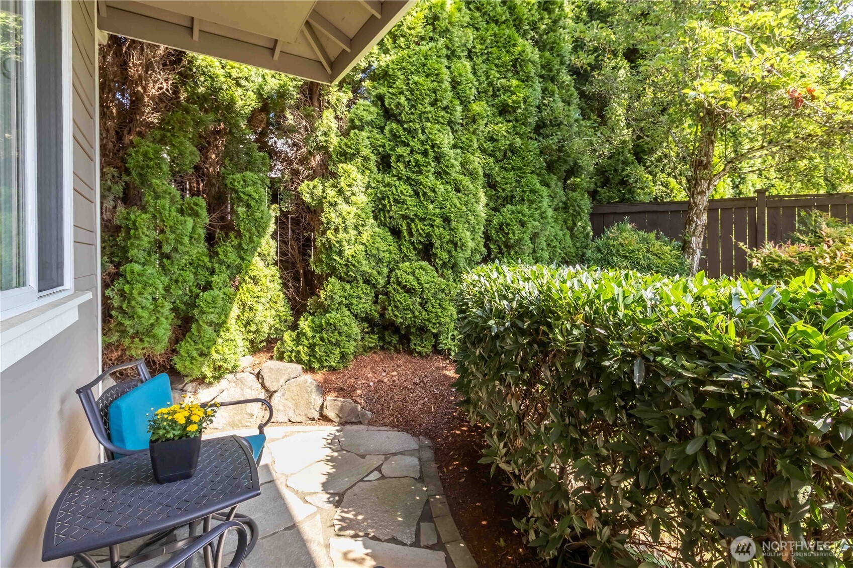 6721 Southeast 2nd Street Renton, WA 98059 - Photo 27 of 32 a backyard of a house with chairs and a fire pit