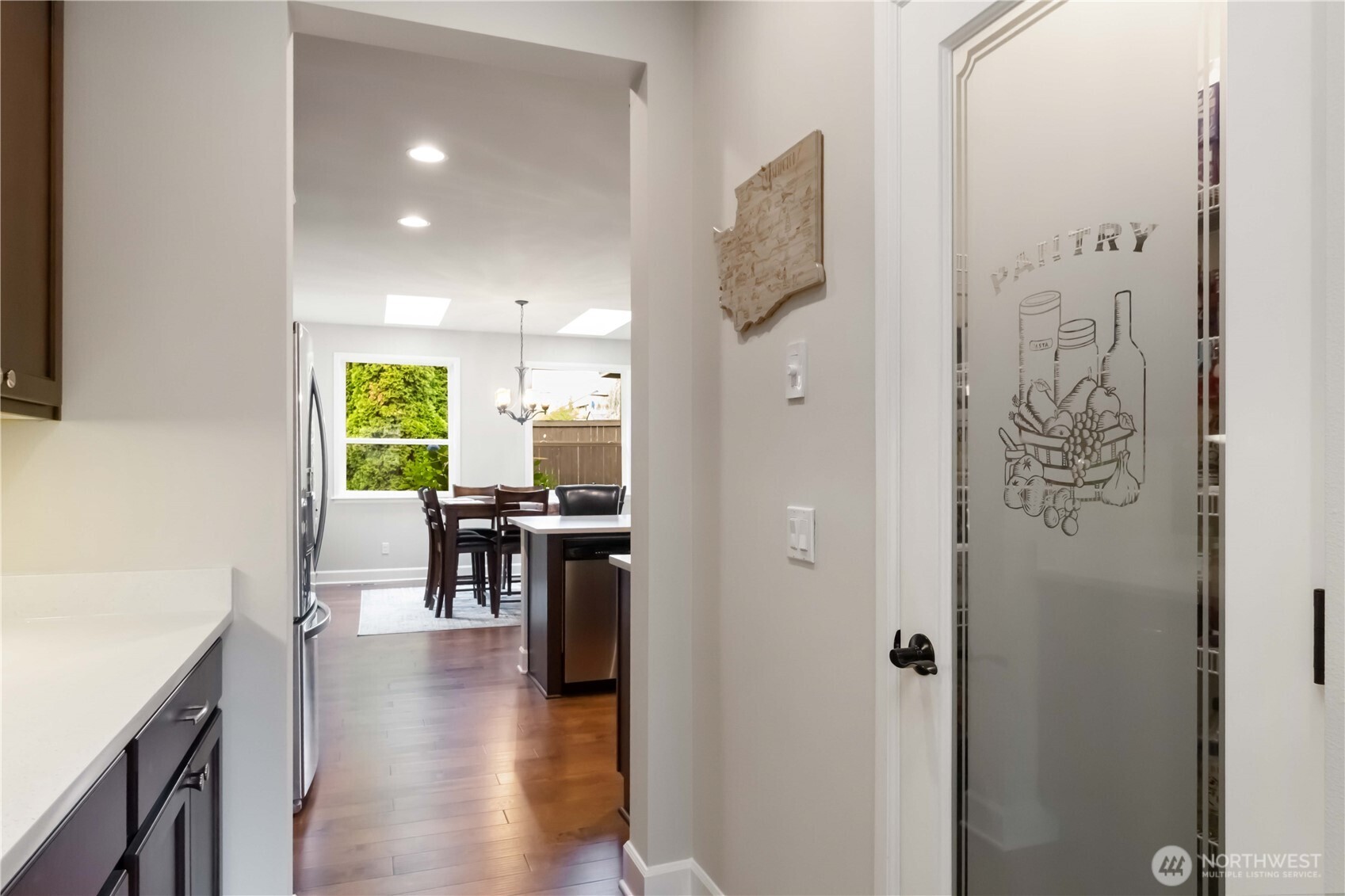 6721 Southeast 2nd Street Renton, WA 98059 - Photo 6 of 32 a kitchen with stainless steel appliances granite countertop a refrigerator and a sink