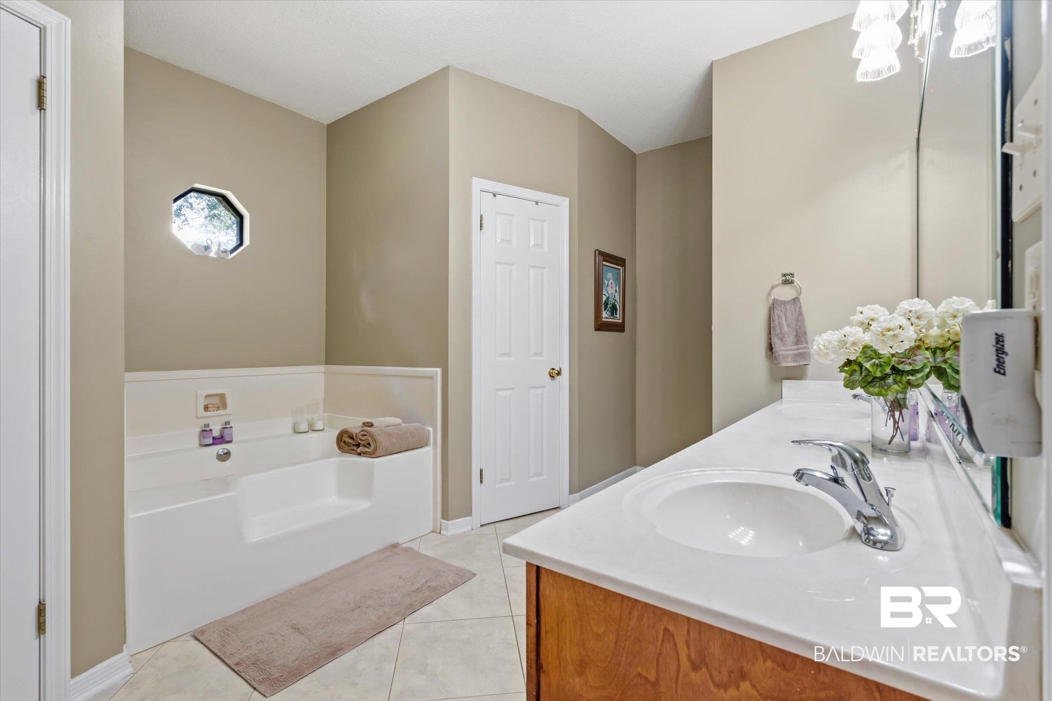 7360 Bridgewood Court Mobile, AL 36695 - Photo 15 of 30 Bathroom featuring a tub to relax in, tile patterned flooring, and vanity
