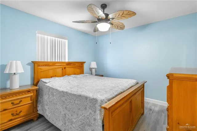 a bedroom with a bed and a dresser