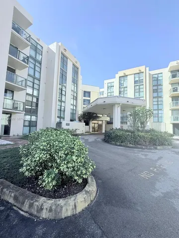 a view of a building with a garden