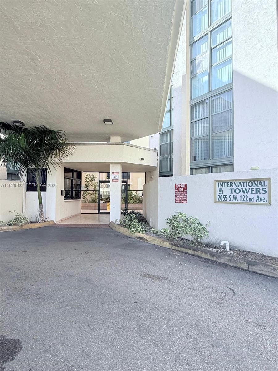 2055 Southwest 122nd Avenue, Unit 415 Miami, FL 33175 - Photo 2 of 13 front view of a house with a street