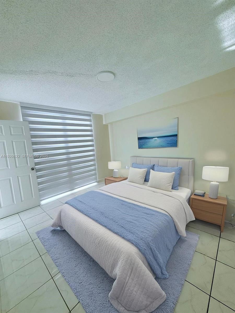 2055 Southwest 122nd Avenue, Unit 415 Miami, FL 33175 - Photo 7 of 13 a bedroom with a bed and a window