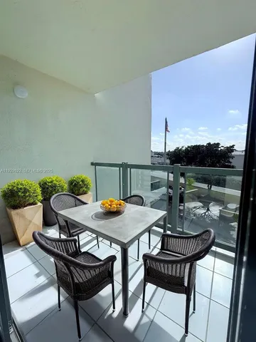 a view of a terrace with furniture and a potted plant