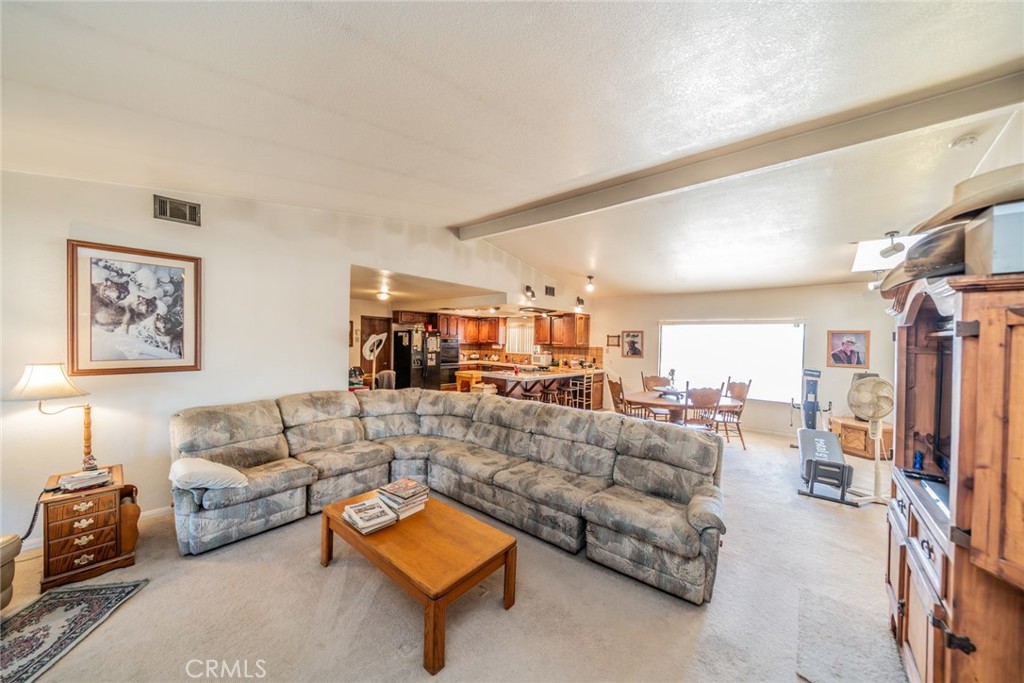 18080 Manitou Road Apple Valley, CA 92307 - Photo 13 of 43 a living room with furniture and a couch