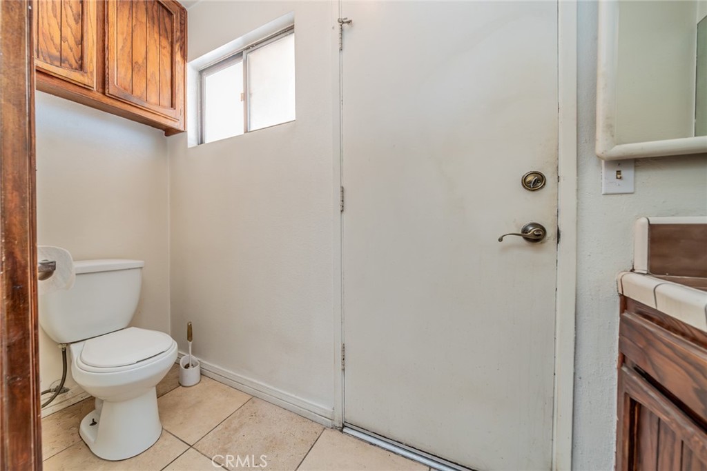 18080 Manitou Road Apple Valley, CA 92307 - Photo 29 of 43 a white toilet sitting next to a shower