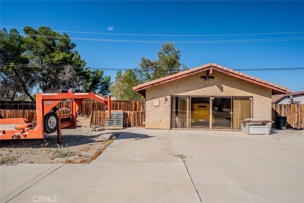 18080 Manitou Road Apple Valley, CA 92307 - Photo 33 of 43 a front view of a house with a garage