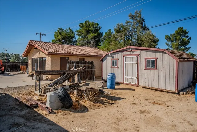 a outdoor space with lots of buildings and trees in the background