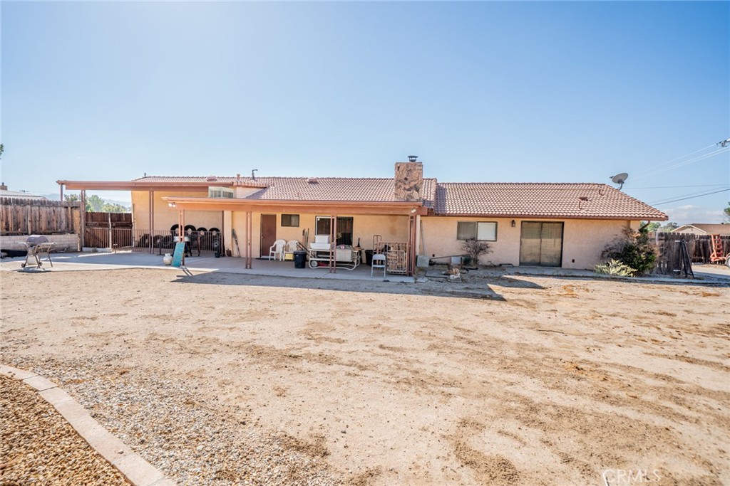 18080 Manitou Road Apple Valley, CA 92307 - Photo 36 of 43 a outdoor space with lots of buildings and trees in the background