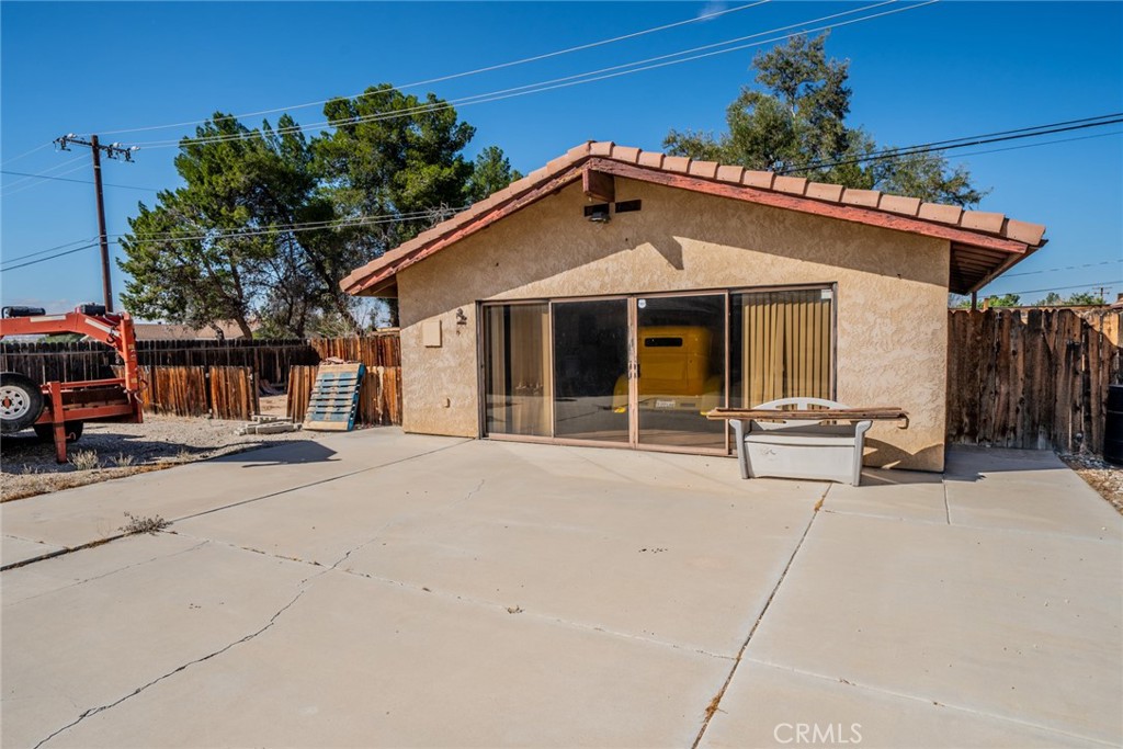 18080 Manitou Road Apple Valley, CA 92307 - Photo 4 of 43 a view of a house with a patio