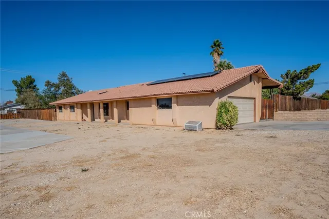 a view of a house with a street