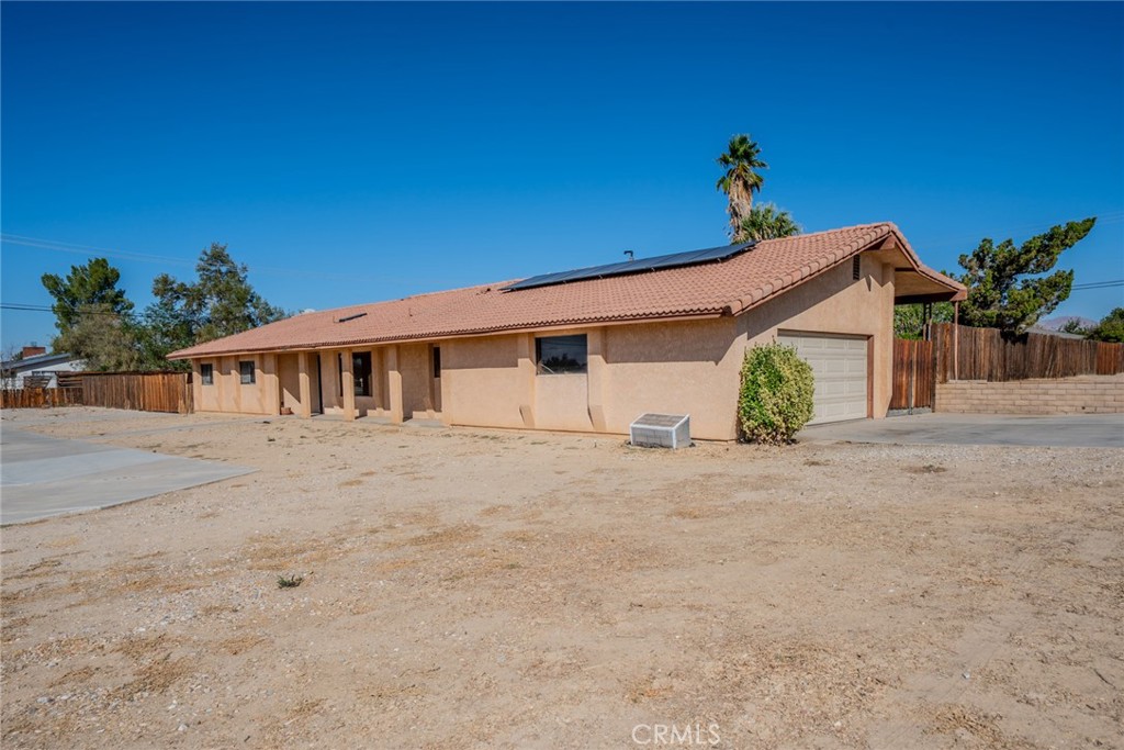 18080 Manitou Road Apple Valley, CA 92307 - Photo 6 of 43 a view of a house with a street