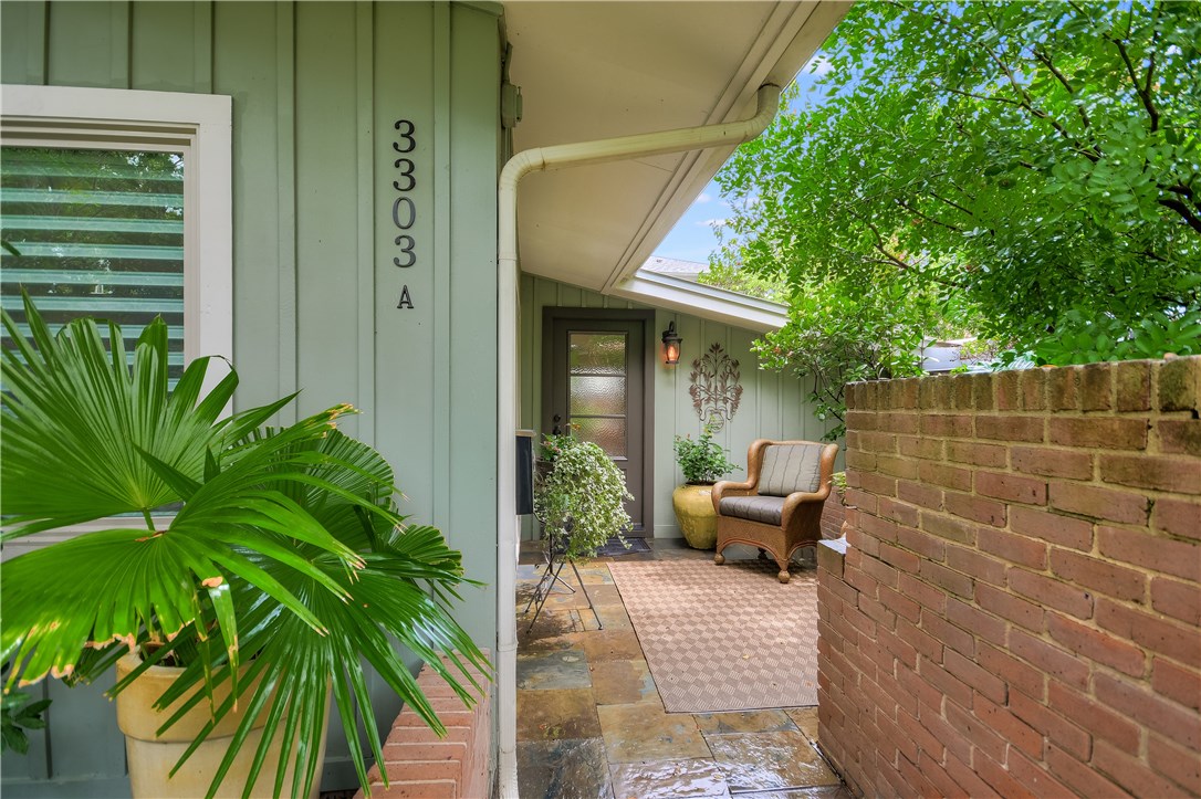 3303 Windsor Road, Unit 2 Austin, TX 78703 - Photo 1 of 1 a view of a patio with chair and potted plants