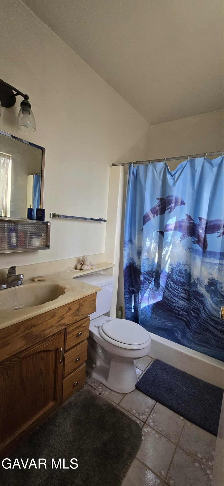 3102 Ave Q-13 Palmdale, CA 93550 - Photo 8 of 10 a bathroom with a sink a toilet and mirror