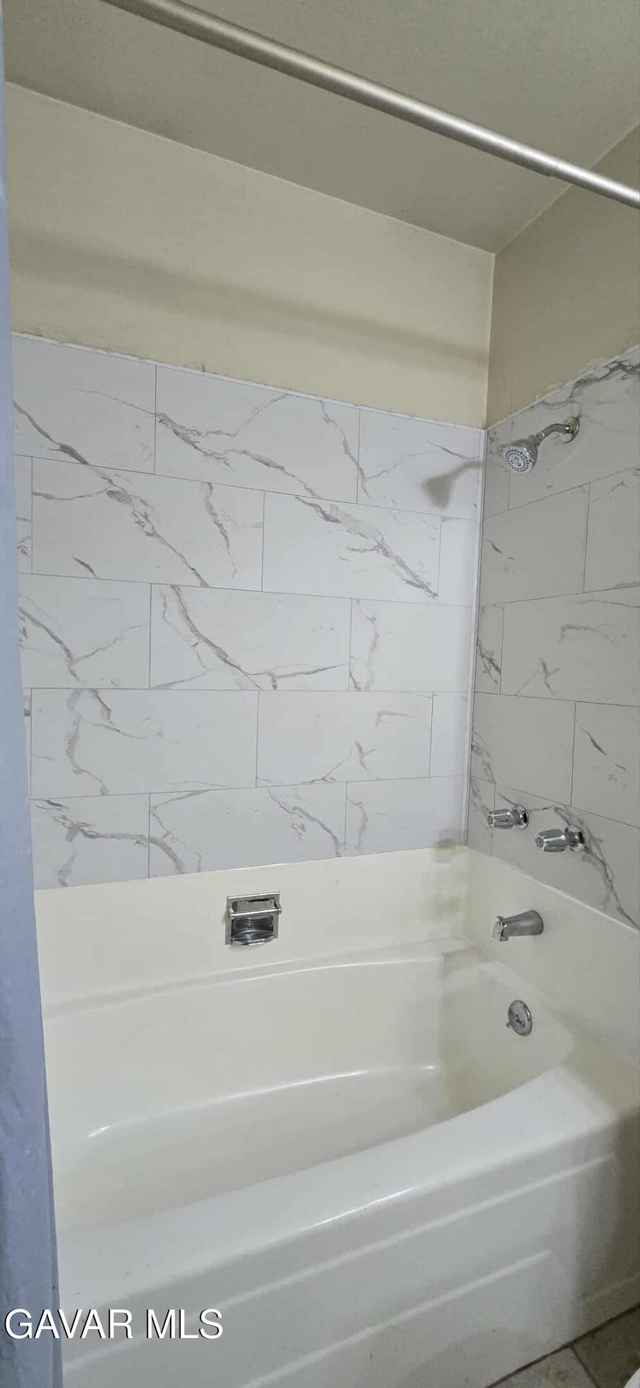 3102 Ave Q-13 Palmdale, CA 93550 - Photo 9 of 10 a bathroom with a bathtub