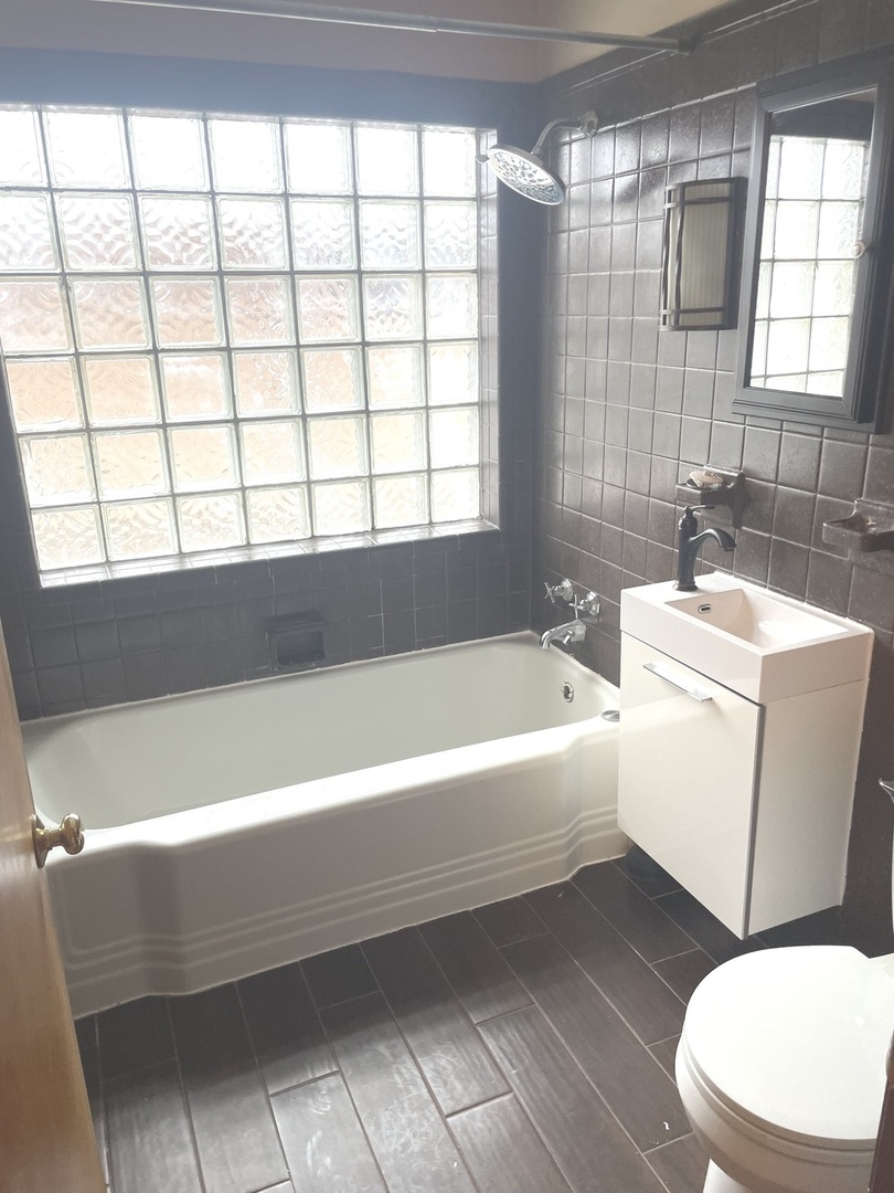 Undisclosed Address La Grange Park, IL 60526 - Photo 14 of 15 a bathroom with a bathtub and a sink