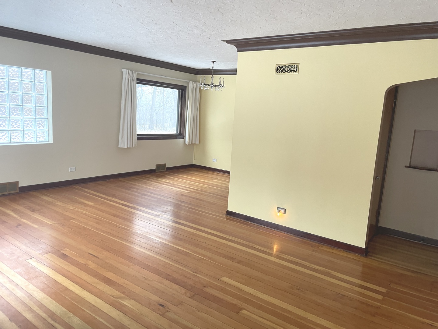 Undisclosed Address La Grange Park, IL 60526 - Photo 5 of 15 an empty room with wooden floor and windows