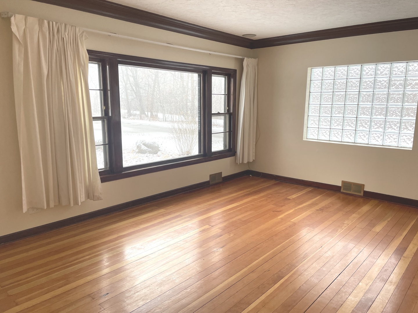 Undisclosed Address La Grange Park, IL 60526 - Photo 6 of 15 a view of an empty room with wooden floor and a window