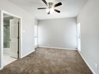4512 Sycamore Street Dallas, TX 75204 - Photo 8 of 23 an empty room with closet and a chandelier fan