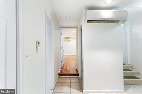 a view of room with wooden floor