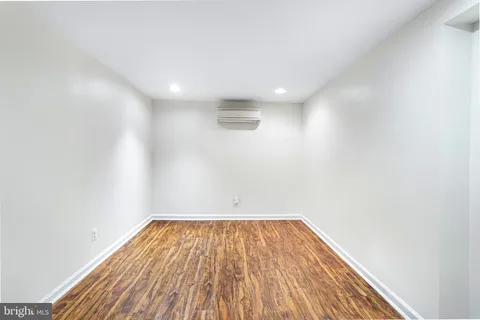 a view of hallway with wooden floor