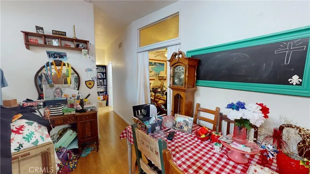 a view of kids room with toys and wooden floor