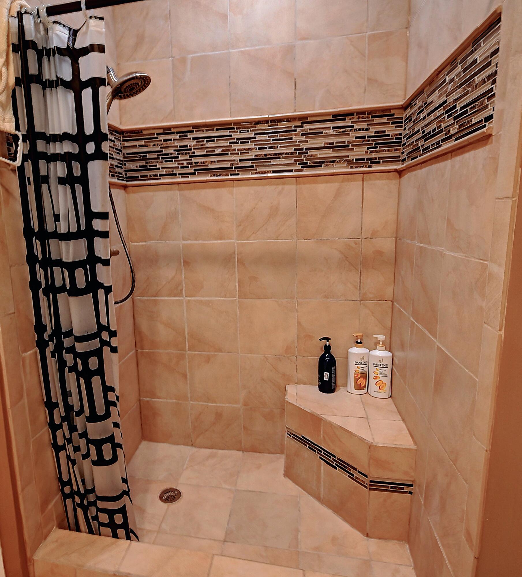 19356 Cherry Hills Terrace Boca Raton, FL 33498 - Photo 13 of 22 a bathroom with a shower and a sink