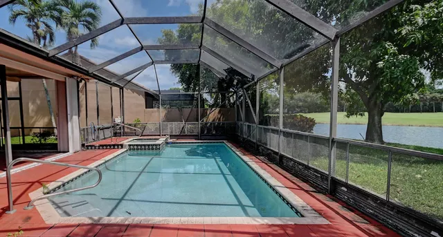 a view of swimming pool with a lounge chair