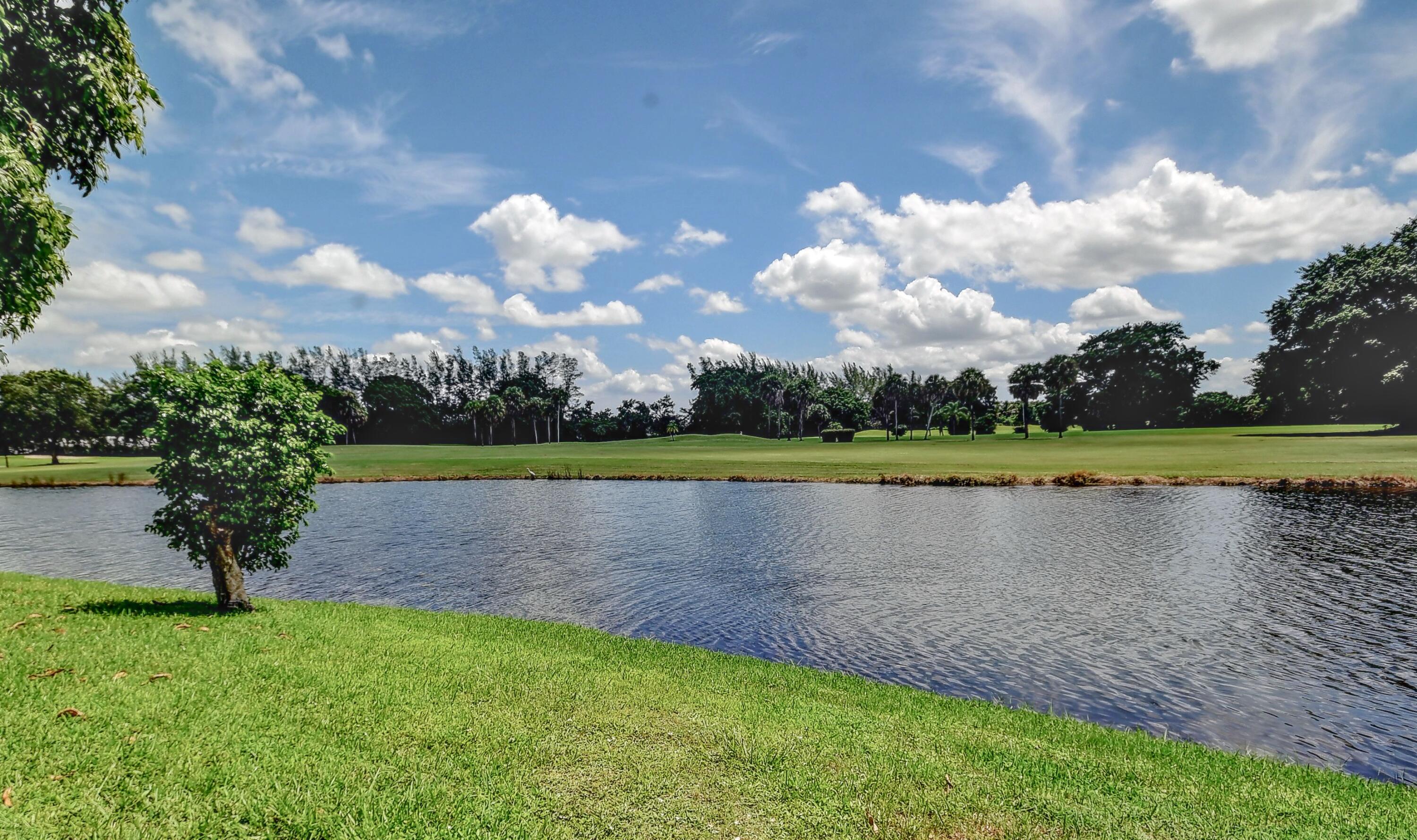 19356 Cherry Hills Terrace Boca Raton, FL 33498 - Photo 20 of 22 a view of a lake with a big yard