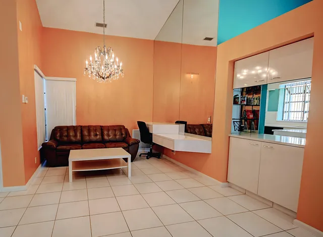 a view of a livingroom with furniture and window