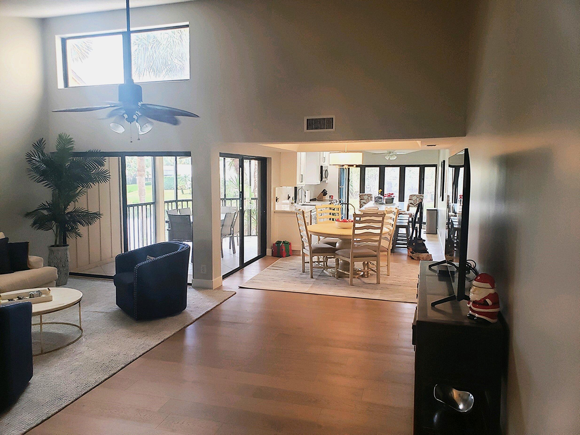 17081 Waterbend Drive, Unit 228 Jupiter, FL 33477 - Photo 6 of 21 a living room with furniture and a large window