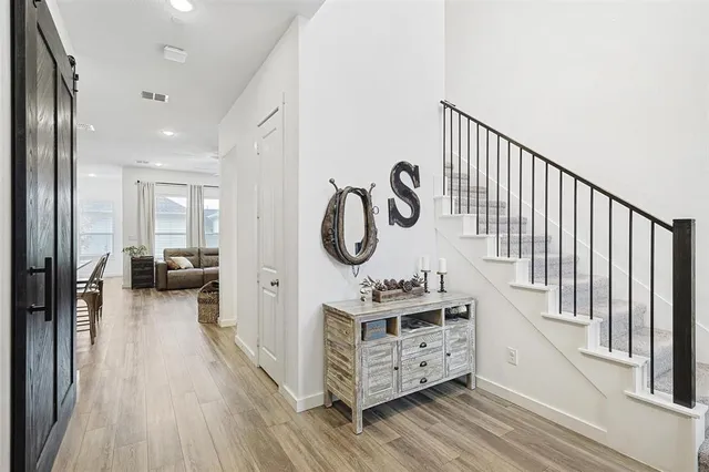 a view of a hallway with seating area