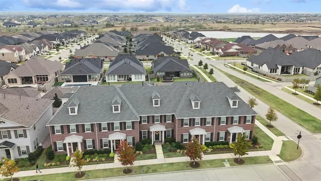 a view of a dining room with furniture a chandelier and wooden floor