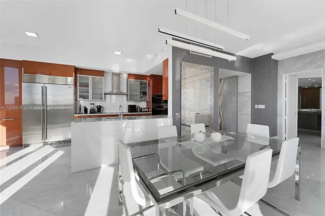 a view of living room filled with furniture and floor to ceiling window