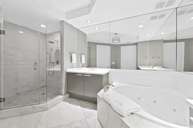 a bedroom with a large bed and a large window