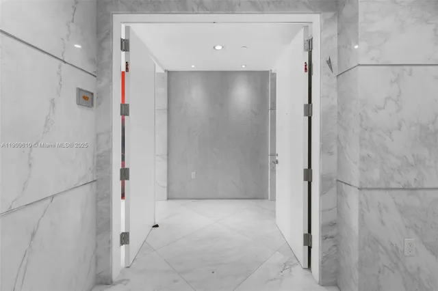 a bathroom with a glass shower door