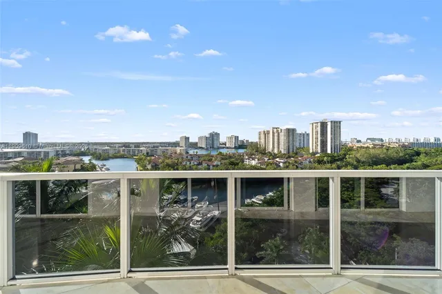 a view of balcony with outdoor seating and city view