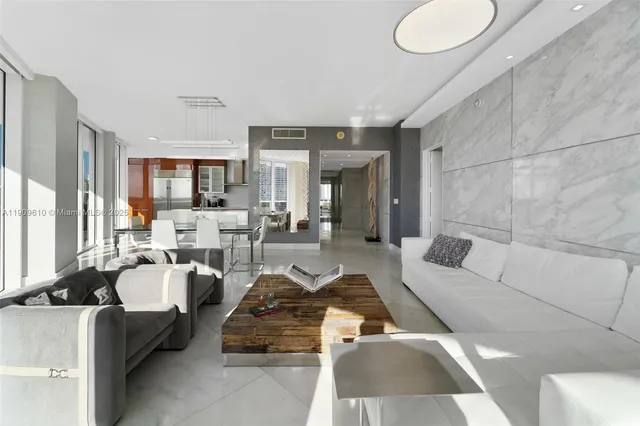 a large kitchen with stainless steel appliances granite countertop a sink and cabinets