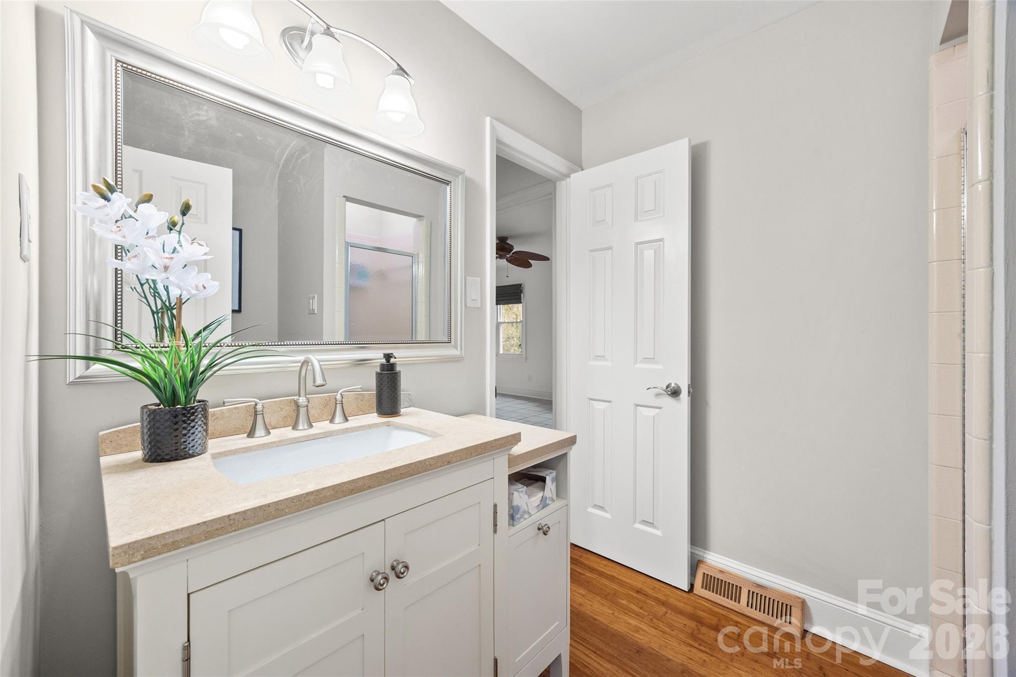 3320 Tilley Morris Road Matthews, NC 28105 - Photo 12 of 48 a bathroom with a sink a vanity and a mirror
