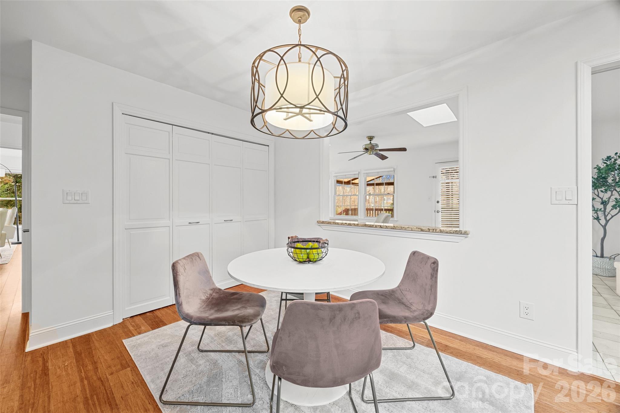 3320 Tilley Morris Road Matthews, NC 28105 - Photo 15 of 48 a view of a dining room with furniture and wooden floor