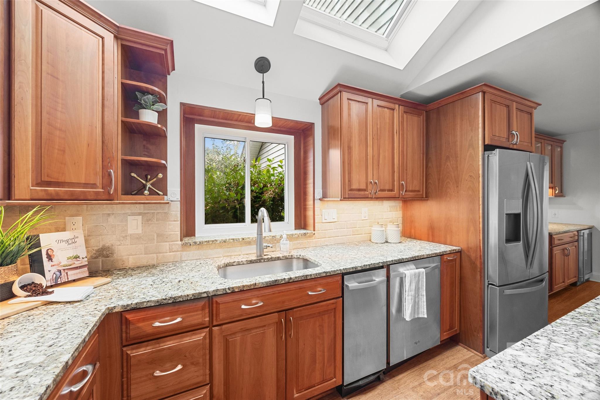3320 Tilley Morris Road Matthews, NC 28105 - Photo 18 of 48 a kitchen with stainless steel appliances granite countertop a sink stove and refrigerator