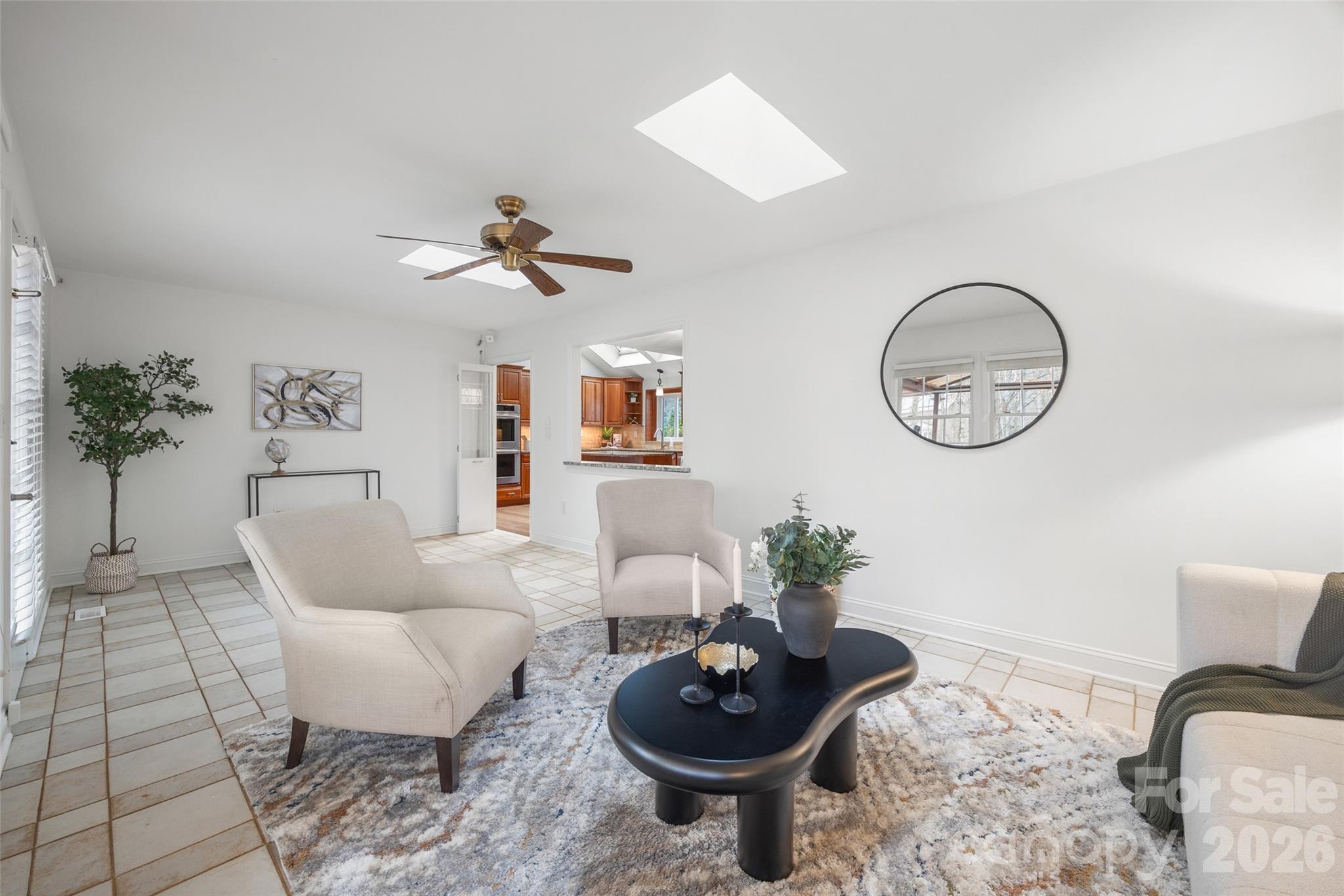 3320 Tilley Morris Road Matthews, NC 28105 - Photo 23 of 48 a living room with furniture a clock and a potted plant
