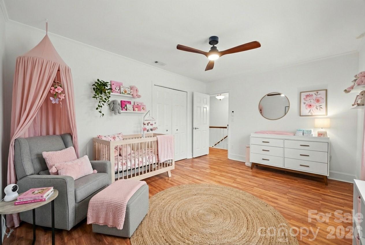 3320 Tilley Morris Road Matthews, NC 28105 - Photo 27 of 48 a bedroom with a bed and a dresser