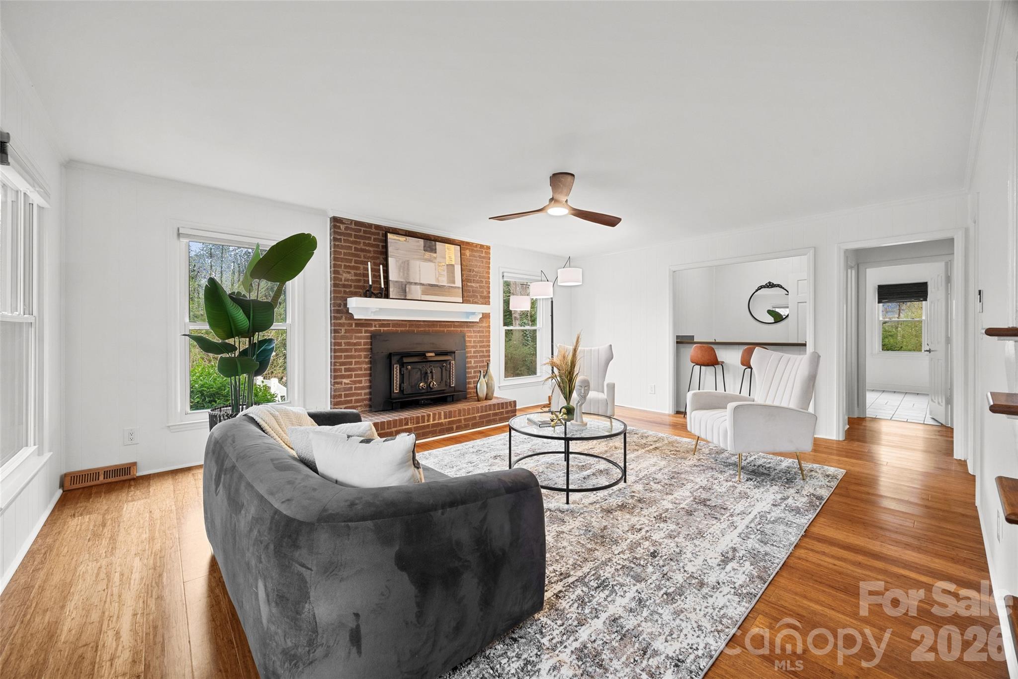 3320 Tilley Morris Road Matthews, NC 28105 - Photo 3 of 48 a living room with furniture and a fireplace
