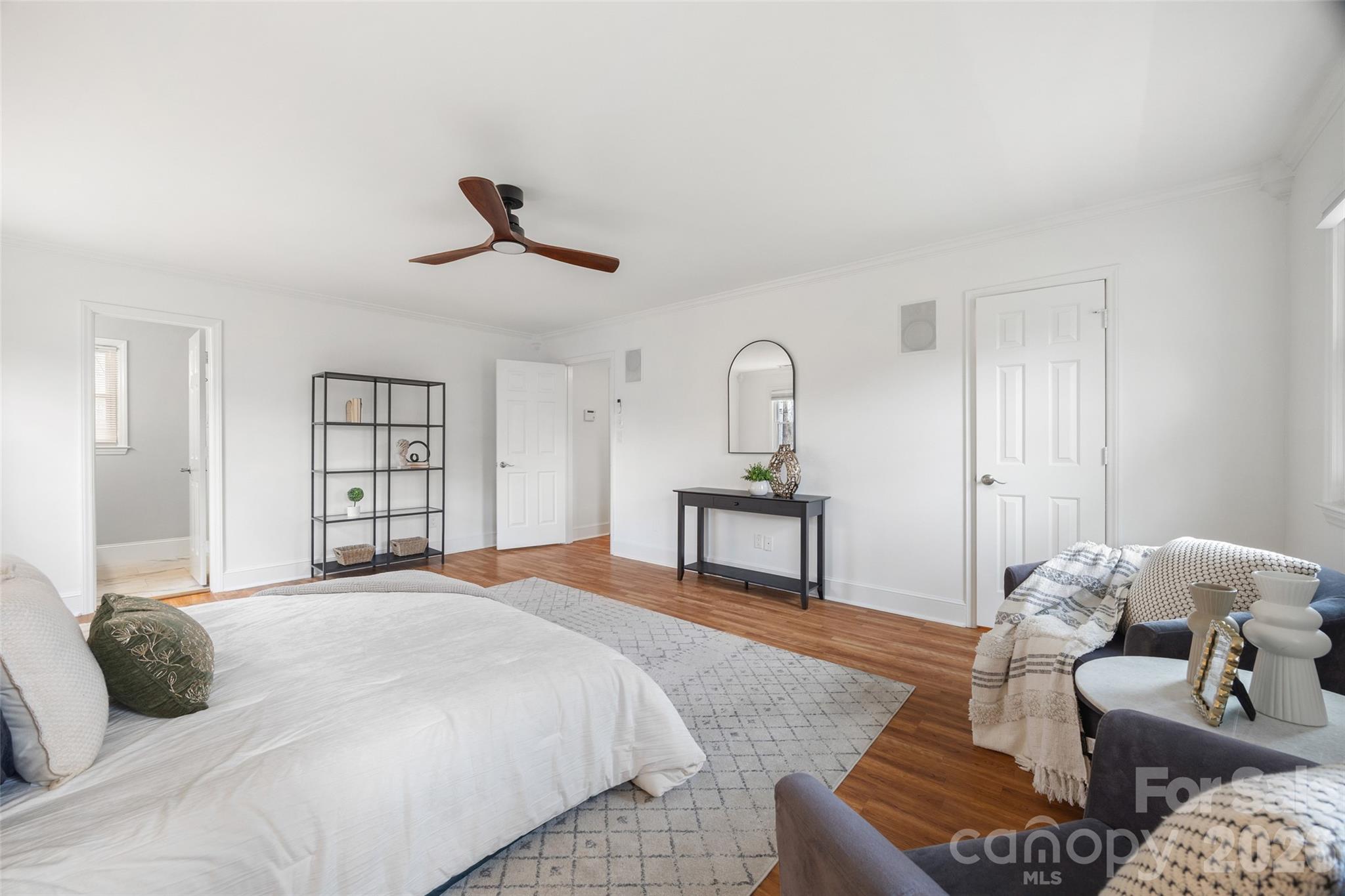 3320 Tilley Morris Road Matthews, NC 28105 - Photo 31 of 48 a bedroom with a bed and wooden floor